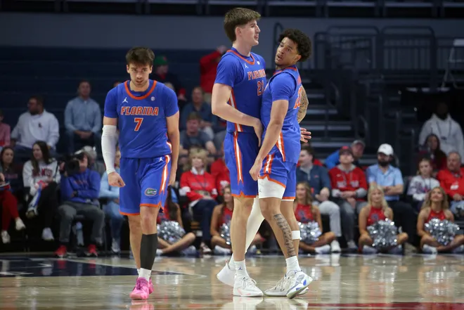 Feb 21, 2026; Oxford, Mississippi, USA; Florida Gators forward/center Alex Condon (21) reacts with guard Isaiah Brown (20) during the second half against the Mississippi Rebels at The Sandy and John Black Pavilion at Ole Miss. Mandatory Credit: Petre Thomas-Imagn Images