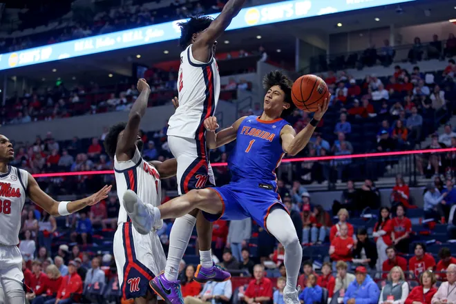 Feb 21, 2026; Oxford, Mississippi, USA; Florida Gators guard Xaivian Lee (1) passes the ball as Mississippi Rebels guard AJ Storr (2) defends during the second half at The Sandy and John Black Pavilion at Ole Miss. Mandatory Credit: Petre Thomas-Imagn Images