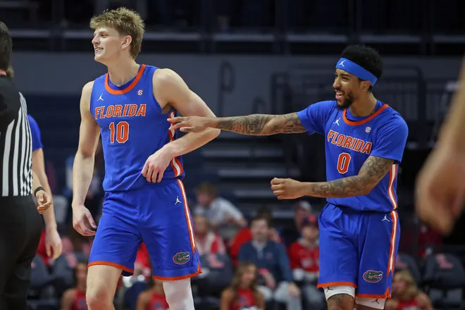 Feb 21, 2026; Oxford, Mississippi, USA; Florida Gators forward Thomas Haugh (10) and guard Boogie Fland (0) react during the second half against the Mississippi Rebels at The Sandy and John Black Pavilion at Ole Miss. Mandatory Credit: Petre Thomas-Imagn Images