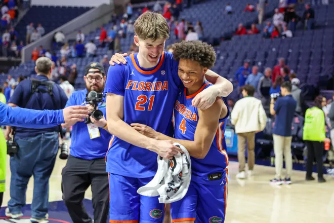OXFORD, MISSISSIPPI - FEBRUARY 21: Alex Condon #21 and Alex Lloyd #4 of the Florida Gators react after winning the game against the Ole Miss Rebels at The Pavilion at Ole Miss on February 21, 2026 in Oxford, Mississippi. (Photo by Wes Hale/Getty Images)