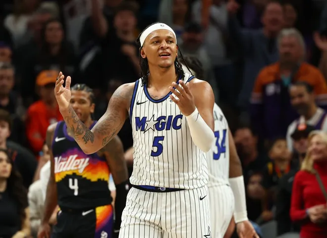 Feb 21, 2026; Phoenix, Arizona, USA; Orlando Magic forward Paolo Banchero (5) reacts against the Phoenix Suns in the second half at Mortgage Matchup Center.