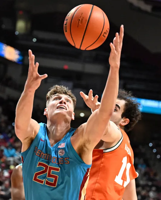 Feb 24, 2026; Tallahassee, Florida, USA; Florida State Seminoles forward Alex Steen (25) reaches for a rebound against Miami Hurricanes forward Salih Altuntas (11) during the first half at Donald L. Tucker Center. Mandatory Credit: Melina Myers-Imagn Images