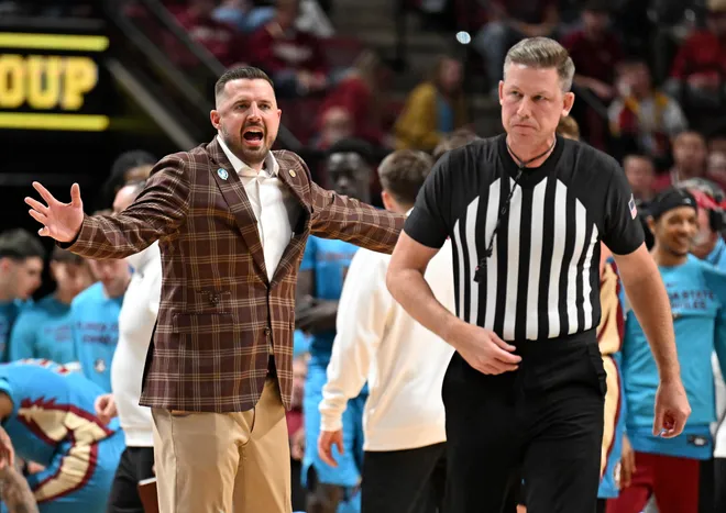 Feb 24, 2026; Tallahassee, Florida, USA; Florida State Seminoles head coach Luke Loucks exchanges words with a referee during the first half against the Miami Hurricanes at Donald L. Tucker Center. Mandatory Credit: Melina Myers-Imagn Images