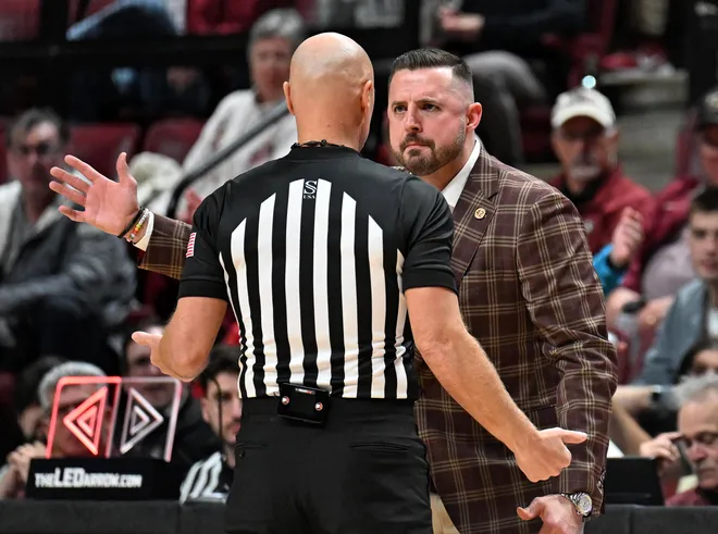 Feb 24, 2026; Tallahassee, Florida, USA; Florida State Seminoles head coach Luke Loucks exchanges words with a referee during the first half against the Miami Hurricanes at Donald L. Tucker Center. Mandatory Credit: Melina Myers-Imagn Images