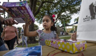Ashley Lopez, 6, plays with her new toys as the Amigos for Kids Toy Drive Caravan made it's final stop at Jose Marti Park in Little Havana on Sunday, December 16, 2018. Amigos for Kids was among 208 nonprofit organizations selected nationwide for an OpenAI Ready Award, the nonprofit announced Tuesday, Feb. 17, 2026.