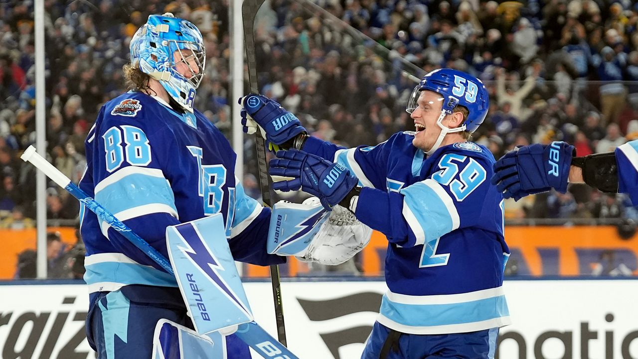 Tampa Bay Lightning goaltender Andrei Vasilevskiy (88) celebrates with center Jake Guentzel (59) after the team defeated the Boston Bruins durring a shootout in a Stadium Series NHL hockey game Sunday, Feb. 1, 2026, in Tampa, Fla. (AP Photo/Chris O'Meara)
