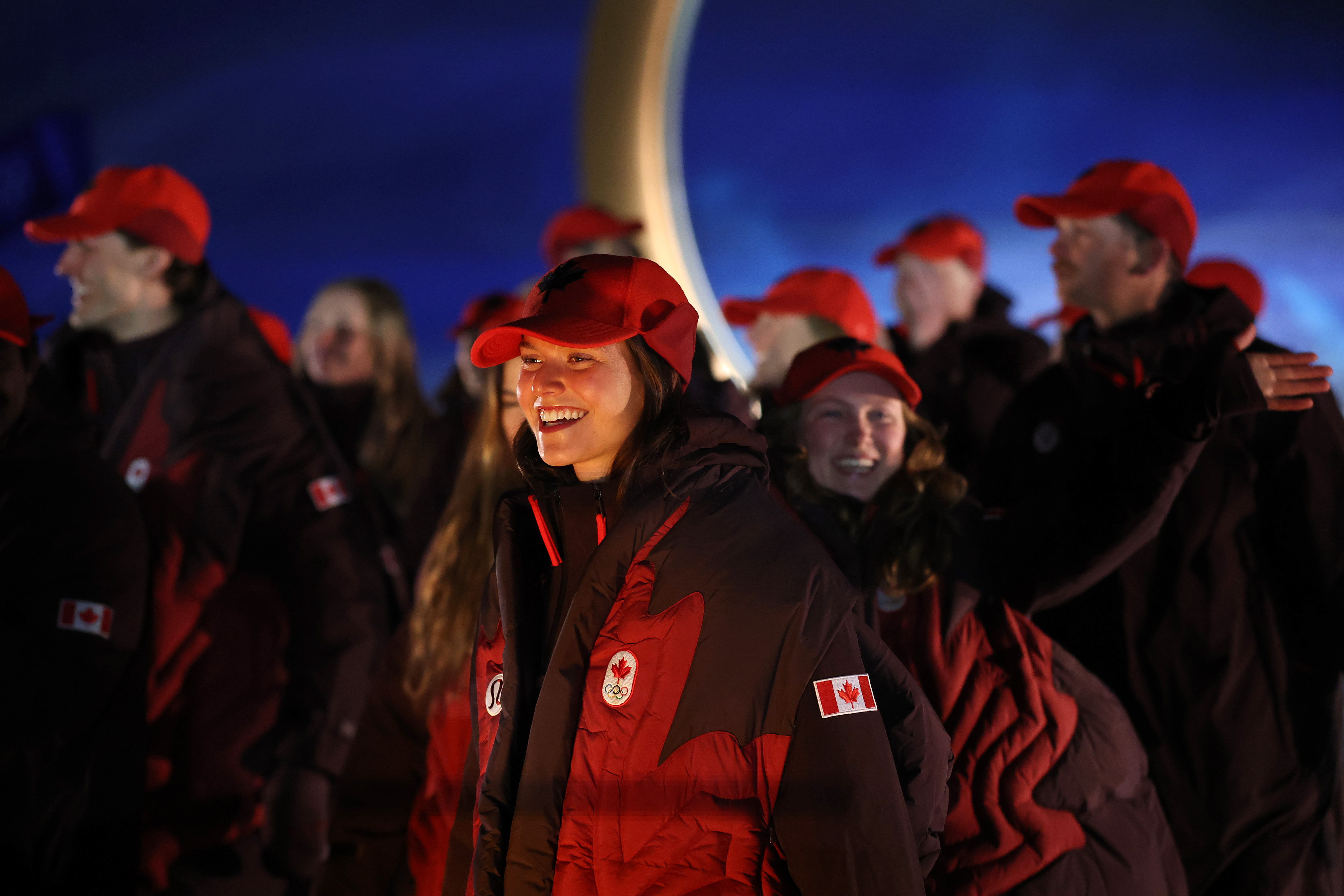 Athletes from Canada walk during the Olympic opening ceremony at...