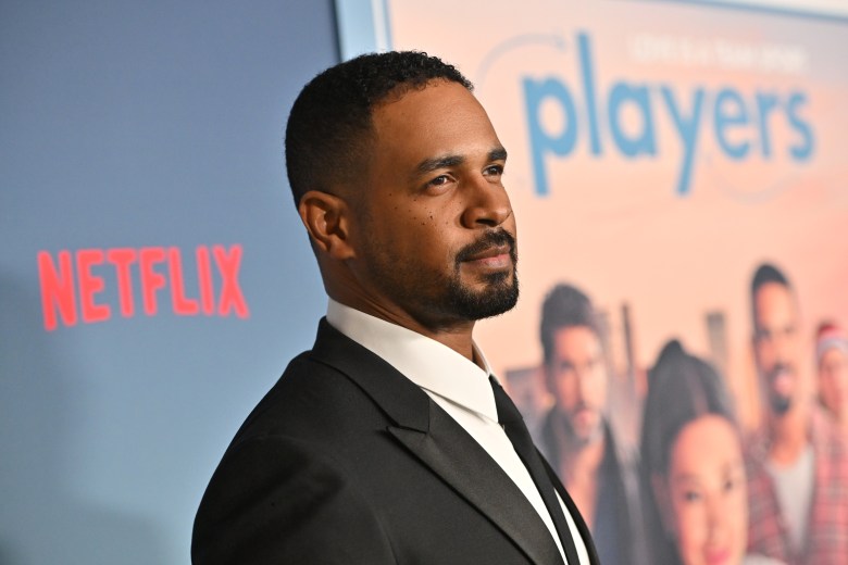 Damon Wayans Jr. poses on the red carpet for Netflix's 'Players' premier.