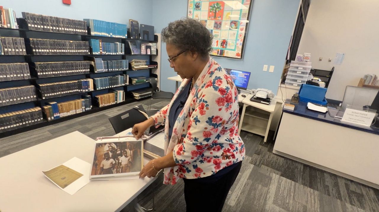 Alberta Lynn Gibbs often goes through materials at Orange County's West Oaks Library genealogy center to discover her family's history.  (Spectrum News 13)