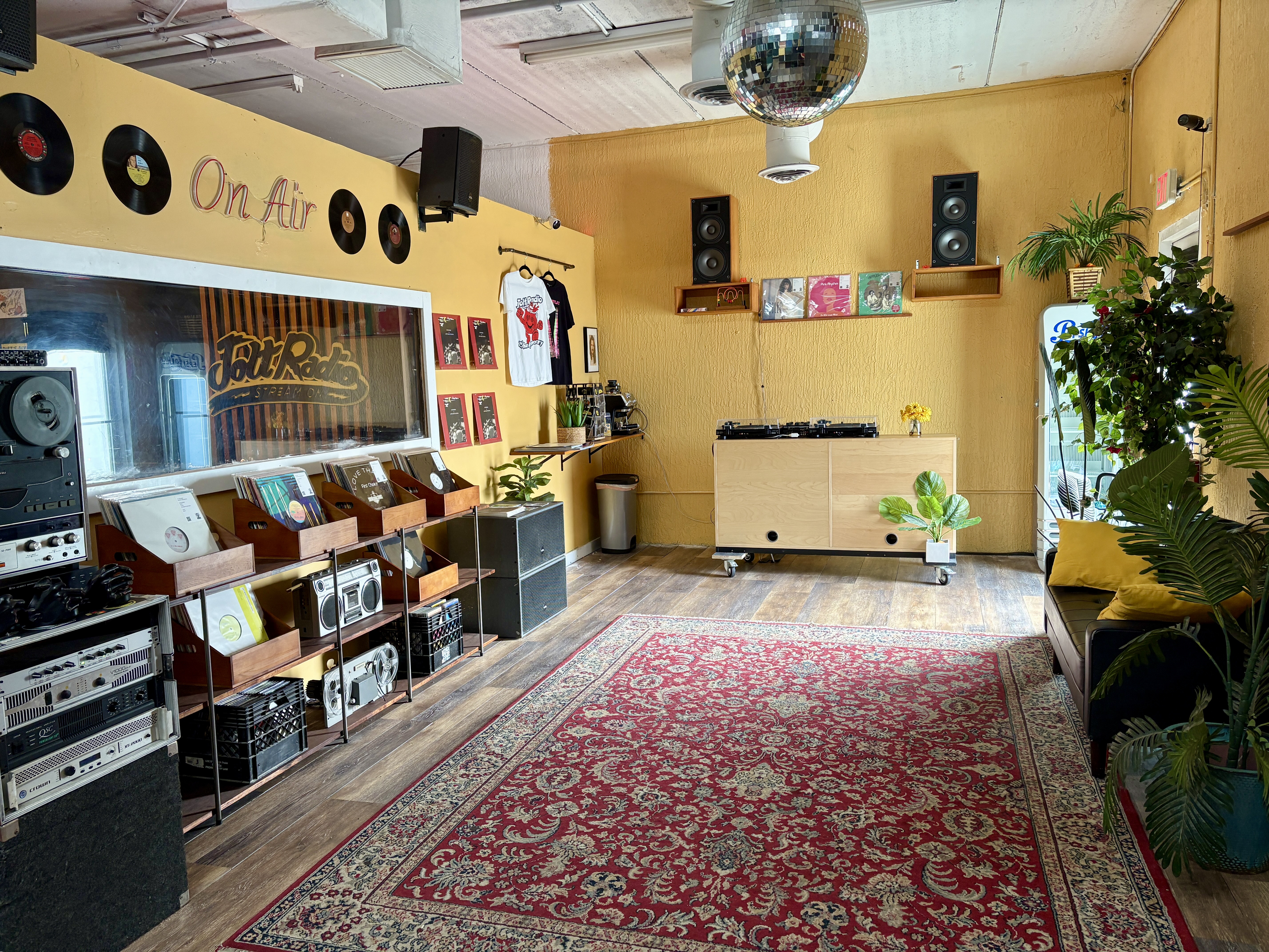 Photo of a space with vinyl records and DJ equipment