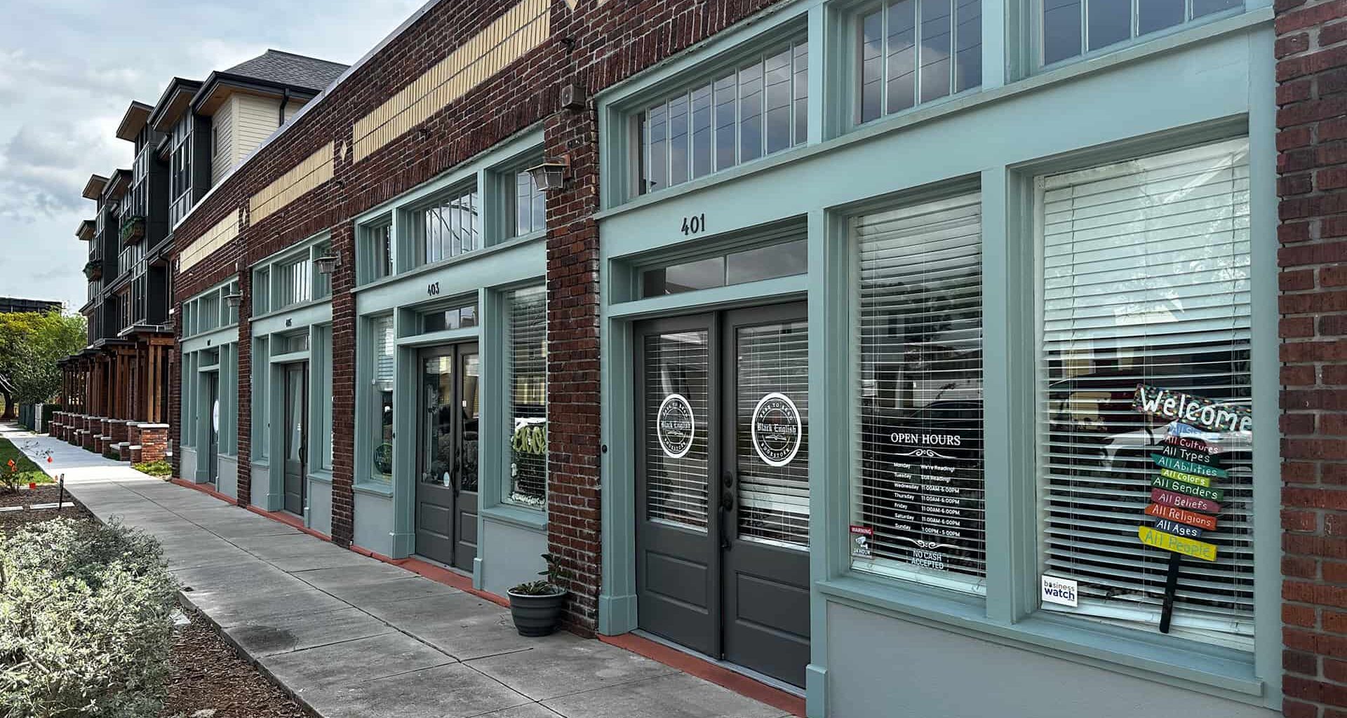 Exterior of a brick building with bookstore signage over the front door