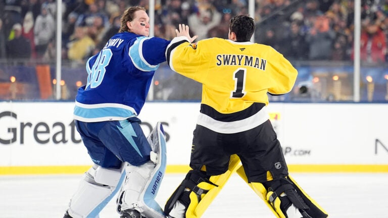 Tampa Bay Lightning goaltender Andrei Vasilevskiy (88) and Boston Bruins goaltender Jeremy Swayman (1) fight during the second period of a Stadium Series NHL hockey game Sunday, Feb. 1, 2026, in Tampa, Fla.