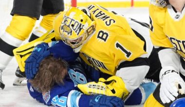 Boston Bruins goaltender Jeremy Swayman (1) takes down Tampa Bay Lightning left wing Brandon Hagel (38) during the second period of a Stadium Series NHL hockey game Sunday, Feb. 1, 2026, in Tampa, Fla.