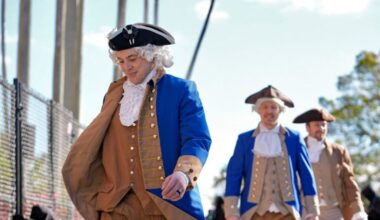 Boston Bruins players, wearing revolutionary war attire, arrive at the stadium before a Stadium Series NHL hockey game against the Tampa Bay Lightning Sunday, Feb. 1, 2026, in Tampa, Fla.