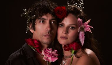 Photo of a couple wearing real flowers