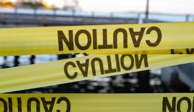 Yellow Caution USA Tape of COVID-19. Coronavirus Outbreak of Quarantine Area, Infection Virus Disease, Risk Area Zone. Biohazard. Lockdown quarantine. Miami Florida Closed. Health Protection Concept.