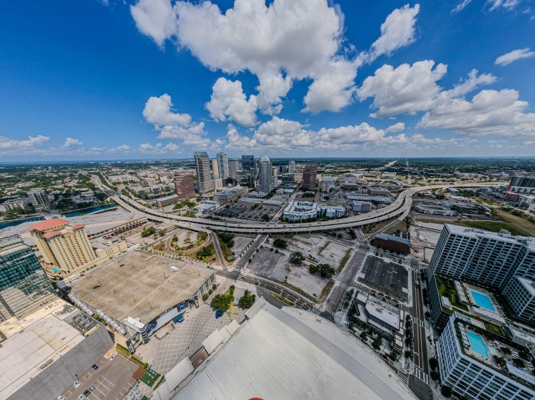 High-angle view of Tampa's urban districts and the Selmon Expressway, where proposed redistricting maps may shift voter precincts by April 2026.