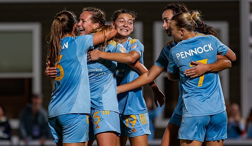 Sporting JAX soccer players celebrate during a match Dec. 13, 2025. From left, they are Sophia Boman, Georgia Brown, Ashlyn Puerta and Jade Pennock.
