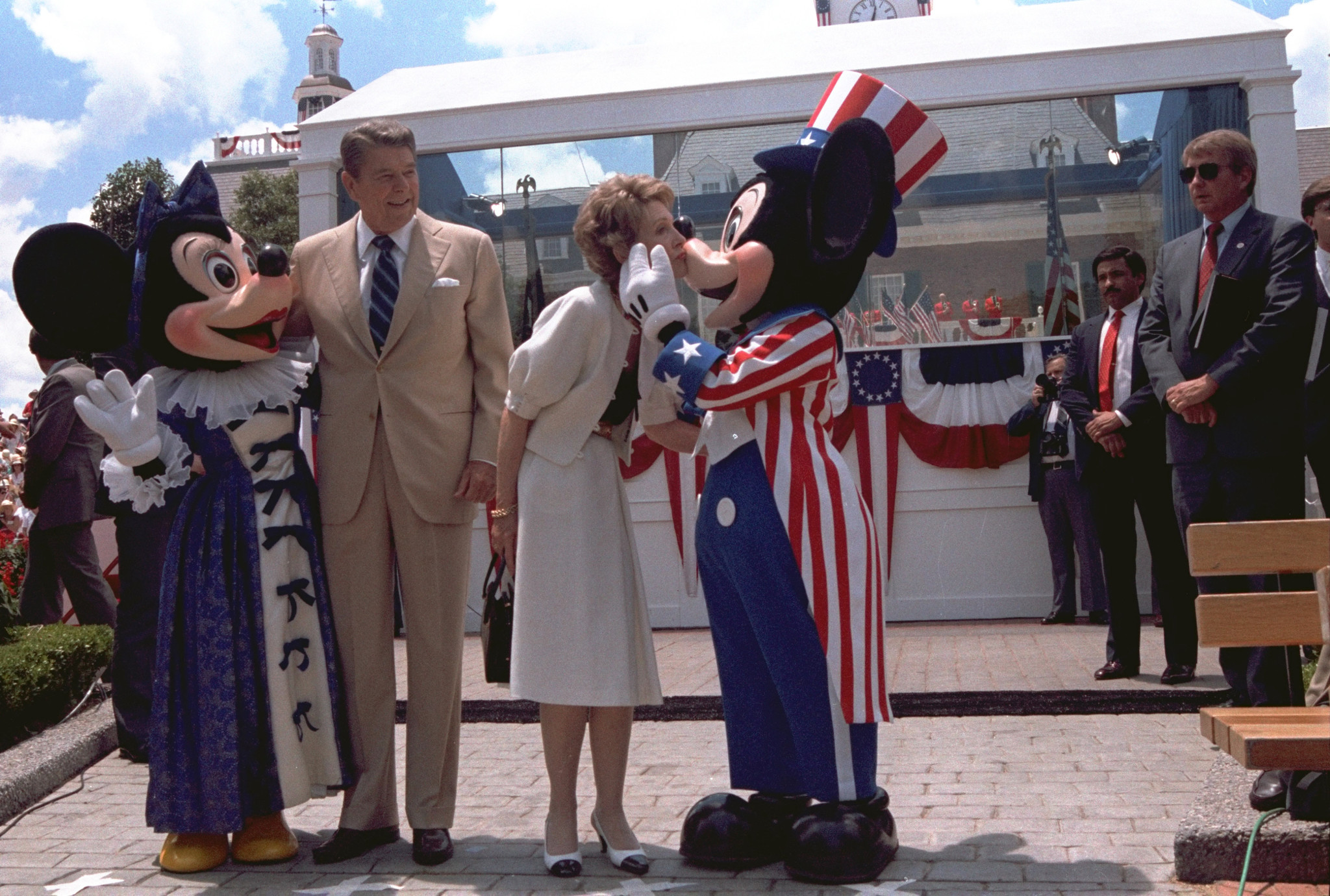 President Reagan and Mrs. Nancy Reagan are shown embracing Minnie...