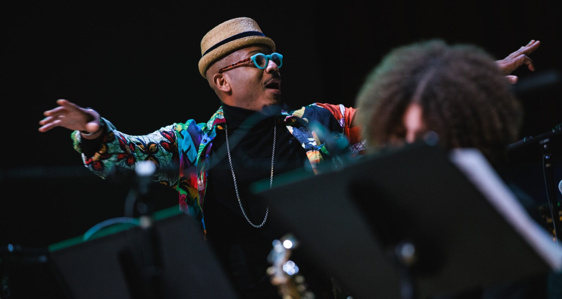 Photo of an orchestra conductor on stage