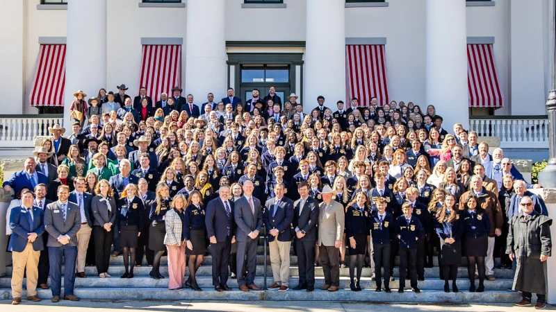 Grasstoots members on the steps of the capital building.