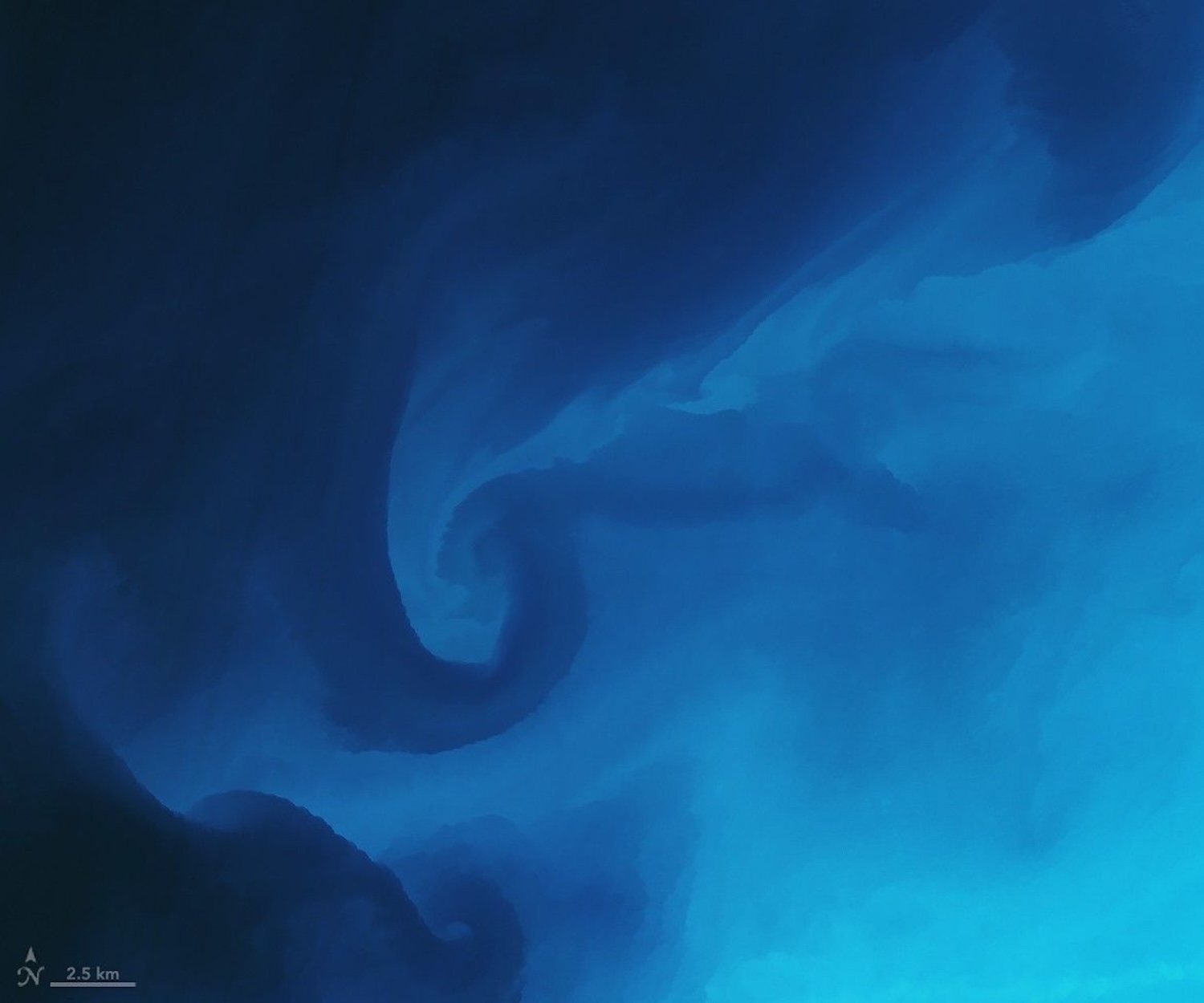 Eddies of two different blue-colored waters swirling together in ocean
