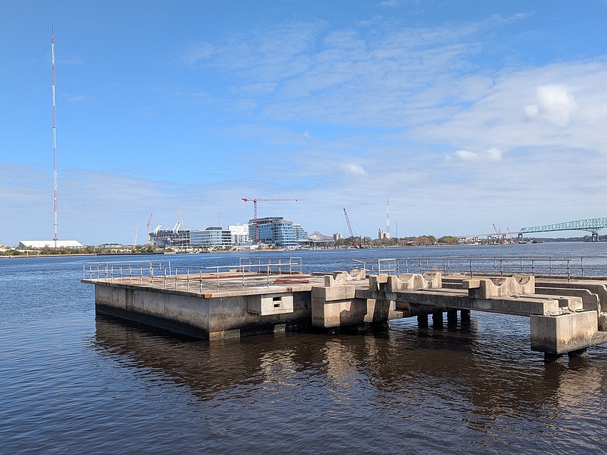 The One Tower Court office building and Four Seasons Hotel and Private Residence are shown Feb. 17 from the Southbank Riverbank near the RiversEdge development.