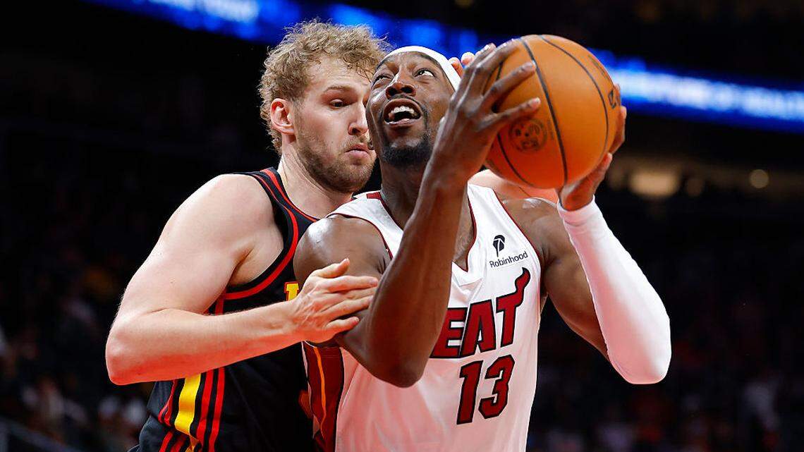 Bam Adebayo #13 of the Miami Heat looks to shoot against Jock Landale #31 of the Atlanta Hawks during the first quarter at State Farm Arena on February 20, 2026 in Atlanta.