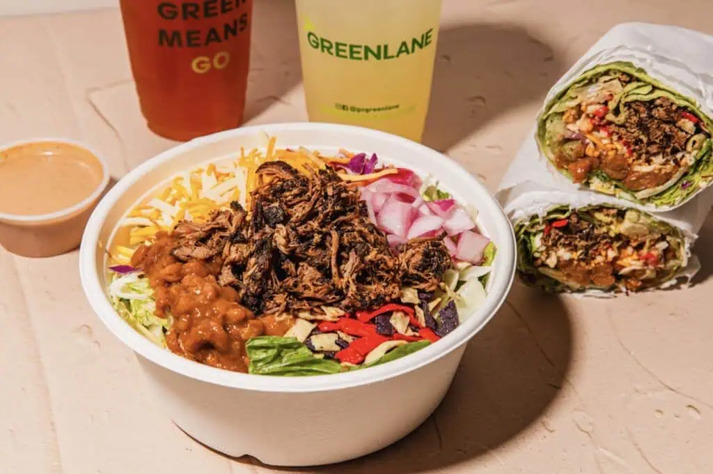 aerial view of a salad bowl with drinks on the side