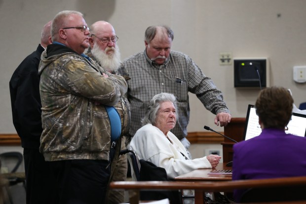 Surrounded by her sons, Norma Padgett, the accuser of the Groveland Four, hits her fist on the table and pleads with the clemency board not to pardon the Groveland Four during a clemency board hearing where the four were pardoned Friday, Jan. 11, 2019. (Tori Schneider/Tallahassee Democrat via The Associated Press)