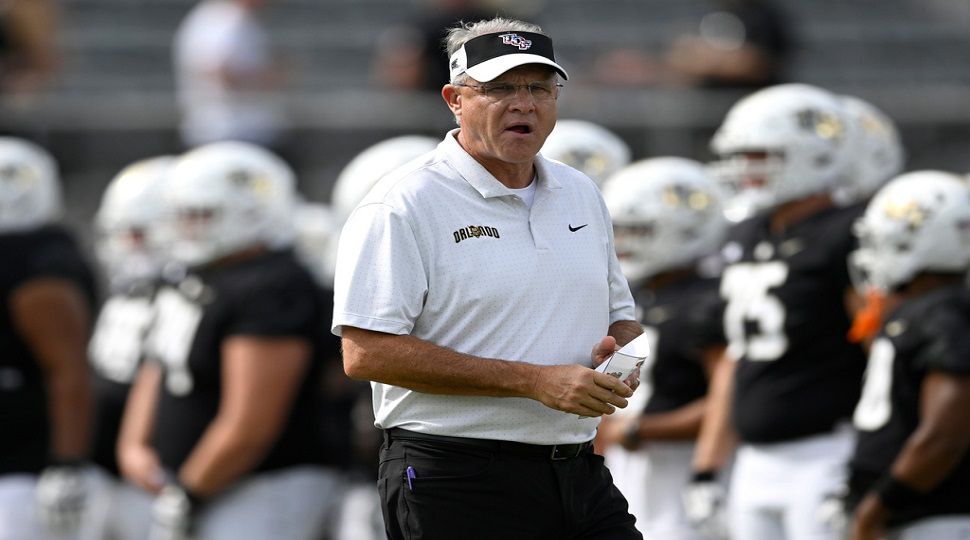 FILE - Central Florida head coach Gus Malzahn looks on as players warm up before an NCAA college football game against Cincinnati, Saturday, Oct. 12, 2024, in Orlando, Fla. (AP Photo/Phelan M. Ebenhack, file)