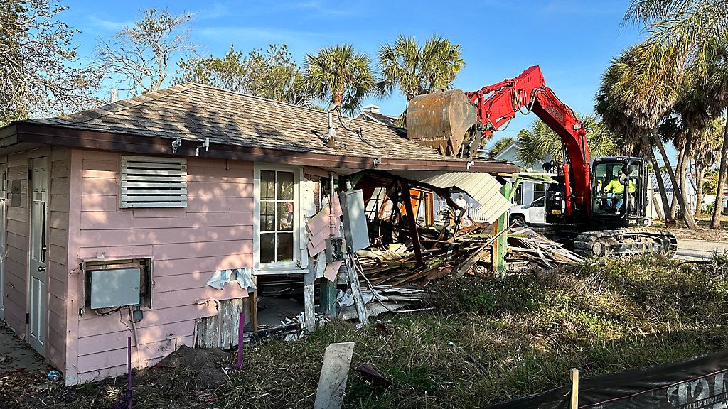 A backhoe tore down the historically designated Pass-a-Grille shuffleboard clubhouse on Thursday after it was damaged by hurricanes in 2024.(Spectrum News/Josh Rojas)