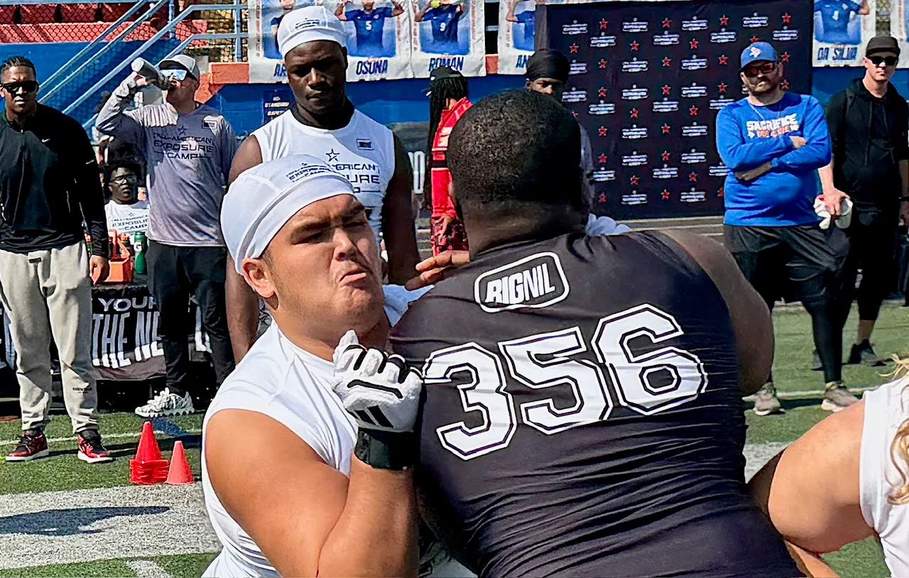 East Ridge senior Fenway Cochrane battles Cocoa senior Tahmeer Passmore...