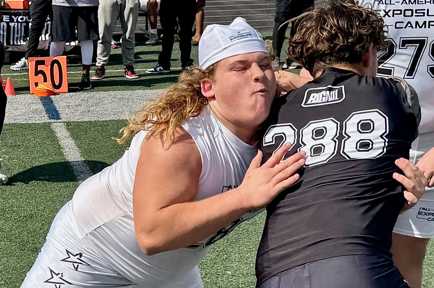 Deltona junior Brayden Koch battles West Orange sophomore Couper Sanders...