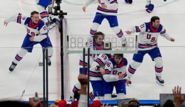 The United States celebrates after a sudden-death overtime goal by United States' Jack Hughes (86) against Canada during the men's ice hockey gold medal game at the 2026 Winter Olympics, in Milan, Italy, Sunday, Feb. 22, 2026. (AP Photo/Luca Bruno)