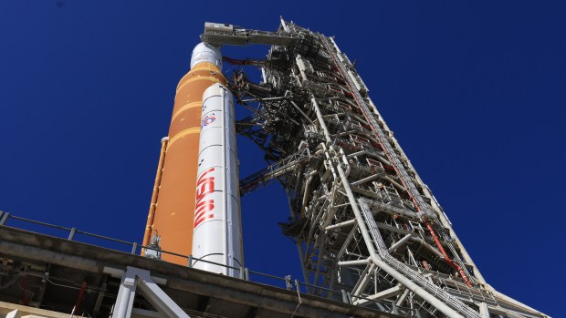 A side view shows one of the twin SLS (Space Launch System) solid rocket boosters, core stage, Orion spacecraft, and launch abort system of NASA's Artemis II rocket at Launch Complex 39-B at NASA's Kennedy Space Center in Florida on Tuesday, Feb. 10, 2026. (Ben Smegelsky/NASA)
