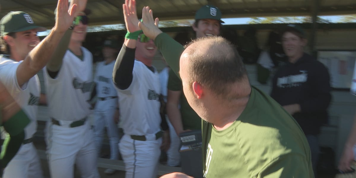 Longtime Thomas University scoreboard operator throws out first pitch