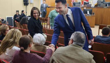 Newly sworn-in Hialeah Mayor Bryan Calvo, center, greets residents and supporters as he attended his first city council meeting on Tuesday, January 13, 2026, at City Hall in Hialeah, Florida.