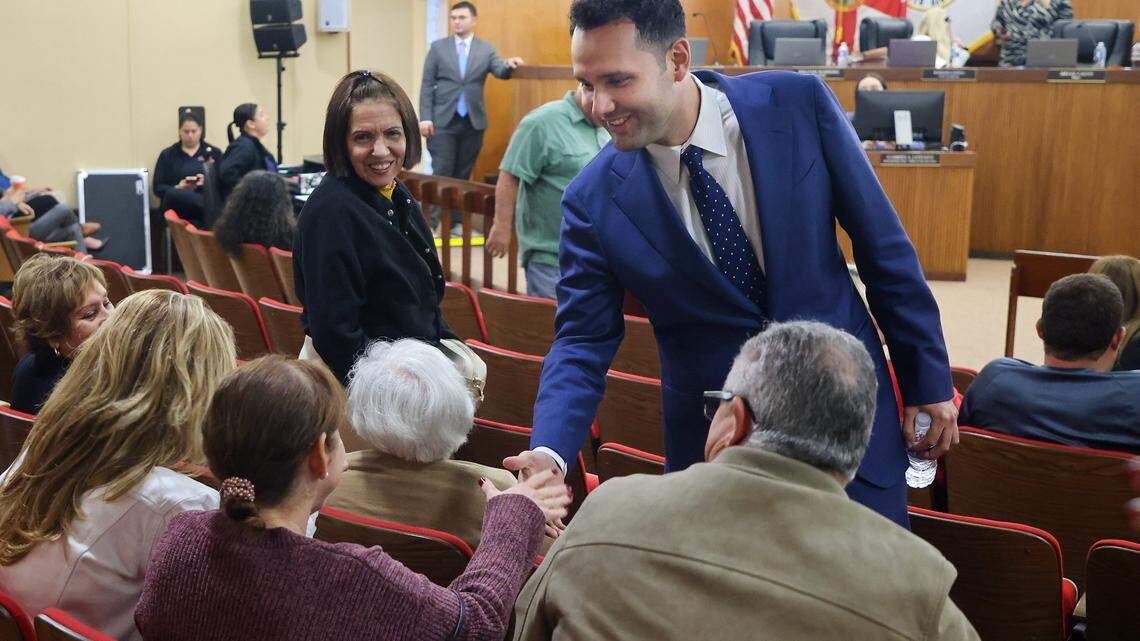 Newly sworn-in Hialeah Mayor Bryan Calvo, center, greets residents and supporters as he attended his first city council meeting on Tuesday, January 13, 2026, at City Hall in Hialeah, Florida.