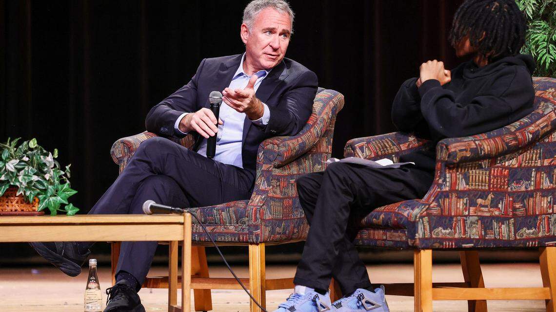 Billionaire Ken Griffin, left, answers Sebastian Mejia's question as he spoke to students during an assembly at Booker T. Washington Senior High School on Tuesday, Feb. 24, 2026, in Miami, Florida.