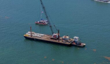 View of a 60-foot barge that hit a 17-foot sailboat that sank off Miami Beach’s Hibiscus Island in Biscayne Bay Monday morning, July 28, 2025. Five children and a camp counselor were aboard the sailboat, part of a Miami Yacht Club summer camp. Three girl campers died and two were injured in the crash.  The parents of the three girls who died have filed suit against the barge owner.