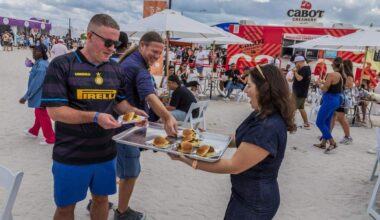Influencer Alessandra Ciuffo-@flavorsbyalssandra serves bites of “Sloppy Giuseppe’s” during the Grand Tasting Village, SoBe Wine & Food Festival, in Miami Beach, on Saturday, February 22, 2025.