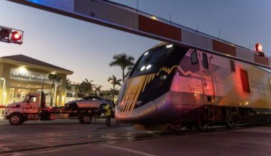 A southbound Brightline train passes the scene of an earlier collision between another Brightline train and a vehicle near the 14100 block of Biscayne Boulevard in Miami on Wednesday, Nov. 19, 2025. One person was airlifted to a trauma center.