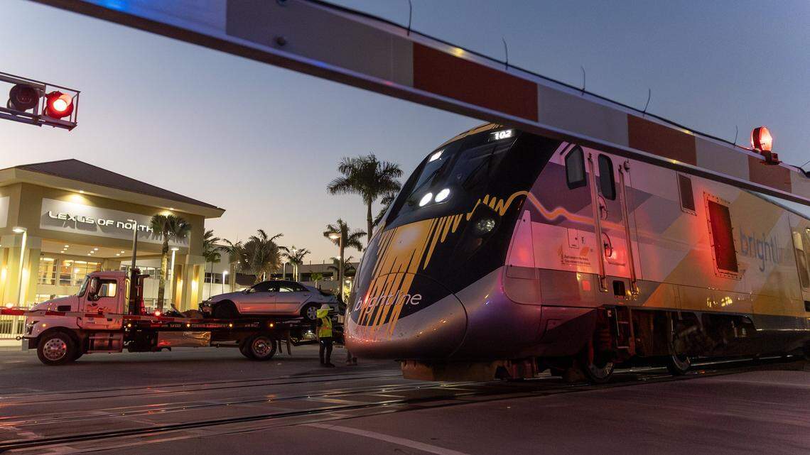 A southbound Brightline train passes the scene of an earlier collision between another Brightline train and a vehicle near the 14100 block of Biscayne Boulevard in Miami on Wednesday, Nov. 19, 2025. One person was airlifted to a trauma center.