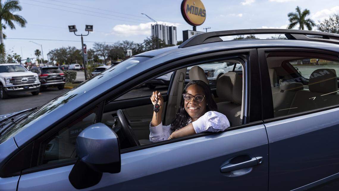 Renee King, 36, is photographed inside the refurbished Subaru Impreza she was gifted at a Midas on Thursday, Feb. 12, 2026, in Fort Lauderdale, Fla. King, a single mom with two children, was forced to give up her previous car and relied entirely on public transportation to get to work.