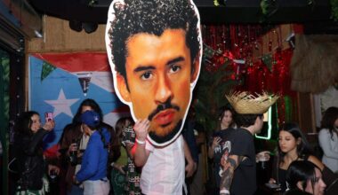 A fan carries a giant Bad Bunny head through The Dead Flamingo bar, which hosted a watch party for the Puerto Rican star’s halftime show.