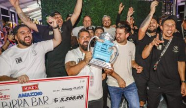 Birra Bar wins as owner Daniel Cocchia hoists Mike's Amazing People's Choice Award Trophy during the annual Burger Bash hosted by Rachael Ray as burger restaurants compete to make the best burgers on Thursday, February 19, 2026.