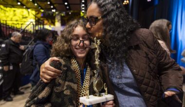 Maxine Williams kisses her son, Lancaster Gramer, 14, an eighth grader from Franklin Academy Cooper City, after he won the 86th Miami Herald Spelling Bee for Broward County at the Charles F. Dodge City Center on Wednesday, Feb. 25, 2026, in Pembroke Pines, Fla. Gramer won the competition after correctly spelling the winning word, californium.