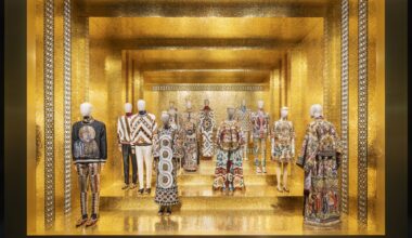 photo of outfits on mannequins inside a room with gold walls and flooring