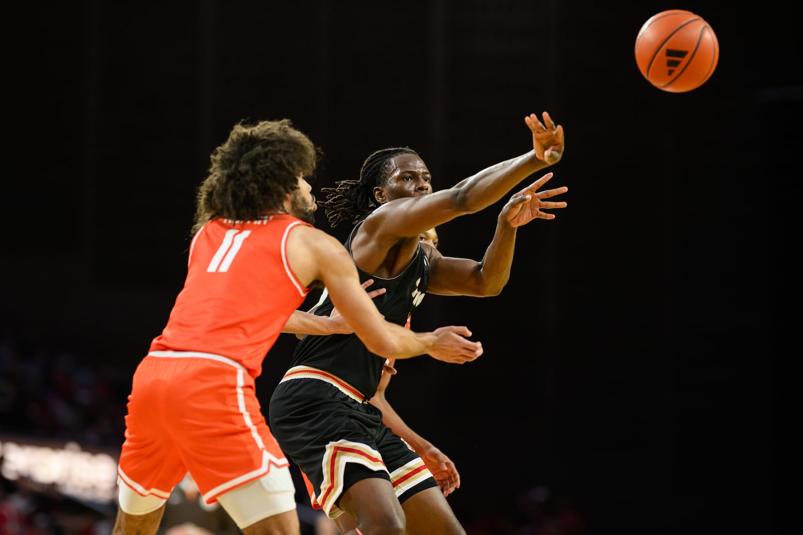 Miami's Antwone Woolfolk passes the ball during the second half of their game against Bowling Green on Friday, Feb. 20, 2026 at Millet Hall. JEREMY MILLER / CONTRIBUTED PHOTO